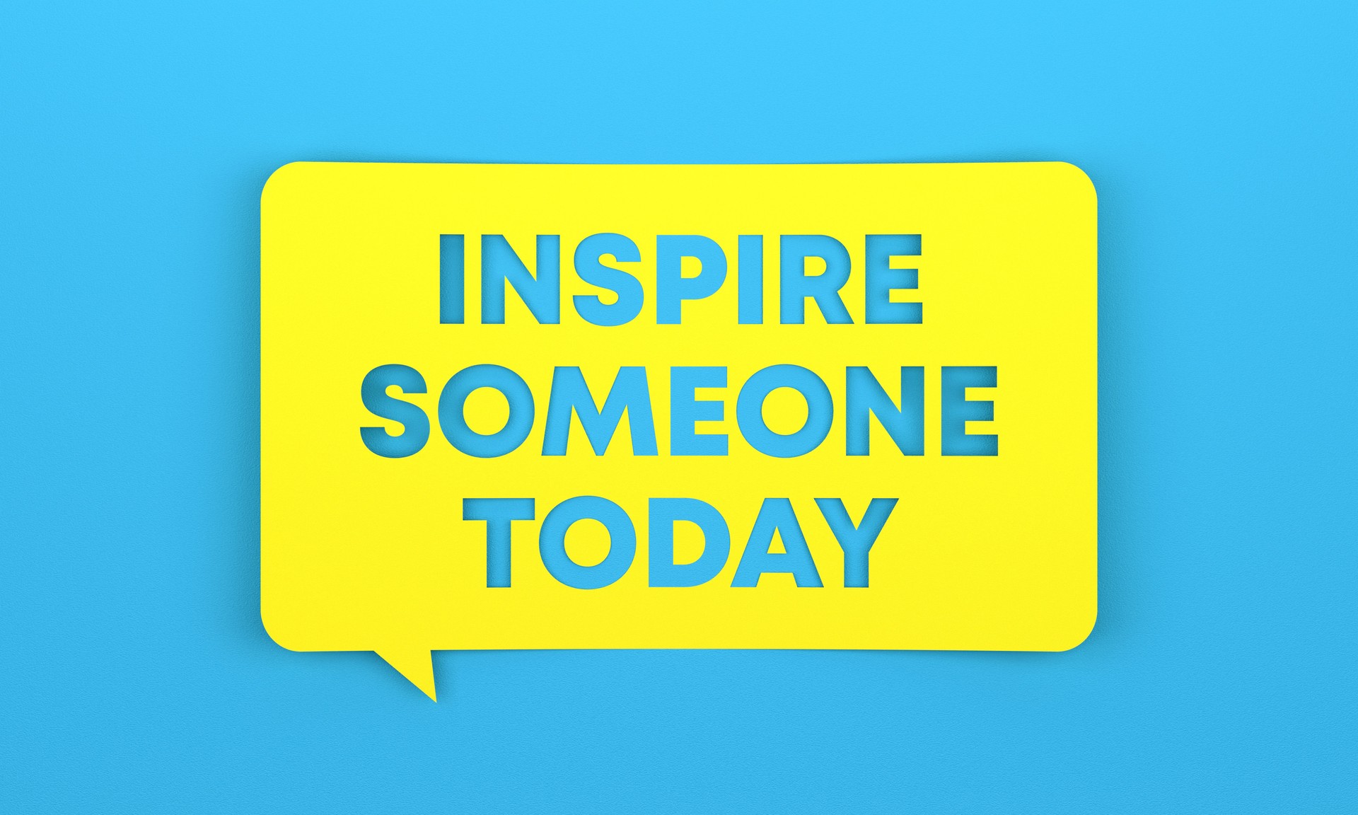 Yellow speech bubble with Inspire Someone Today lettering on blue background